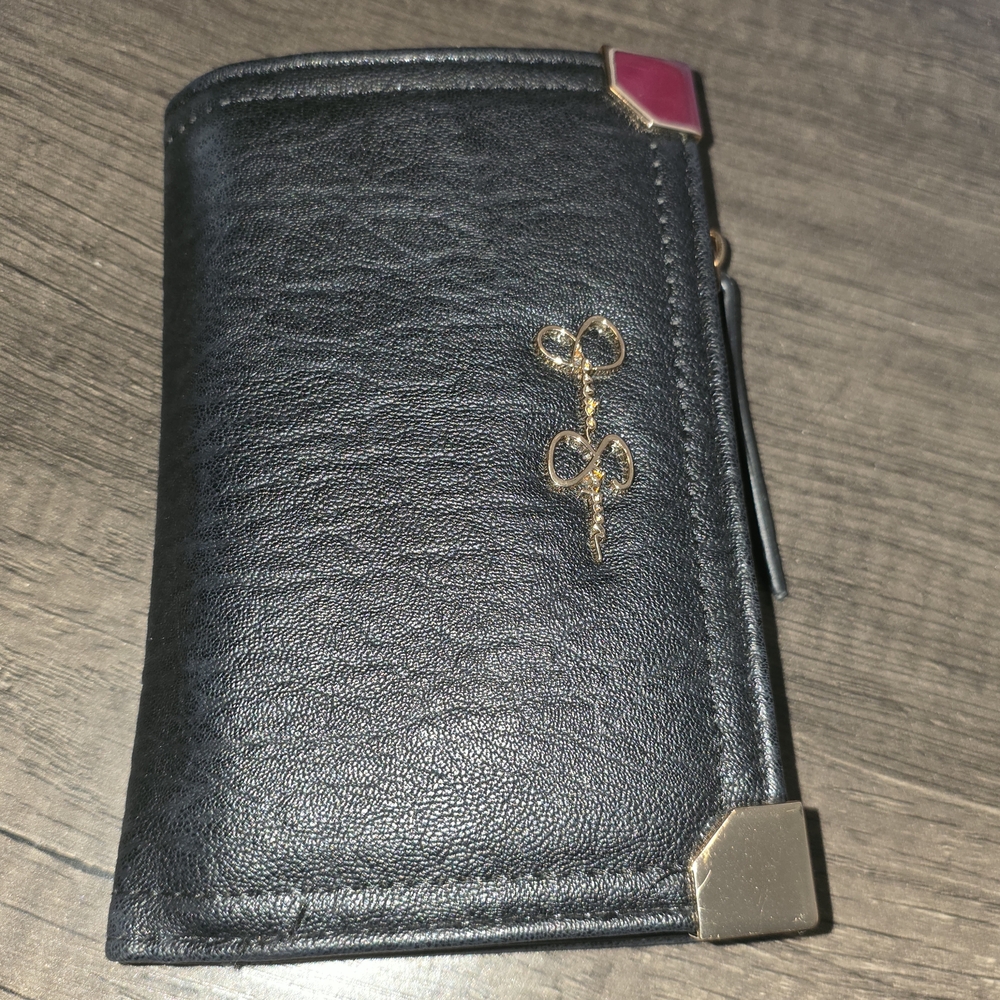 Elegant Black Wallet with Gold and Pink Details